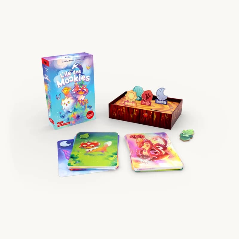 Boîte du jeu de société L'Île des Mookies avec ses cartes illustrées et ses jetons